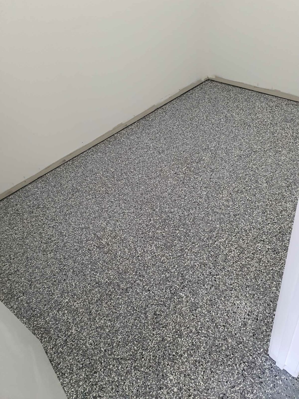Grey flake room floor by PrimeShield Epoxy